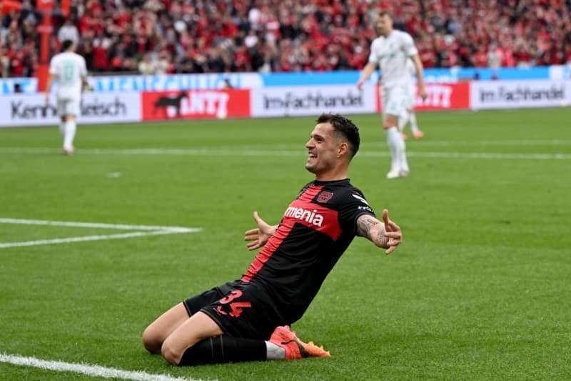 Leverkusen's Granit Xhaka celebrates scoring his side's second goal during the German Bundesliga soccer match between Bayer 04 Leverkusen and SV Werder Bremen at BayArena. Federico Gambarini/dpa