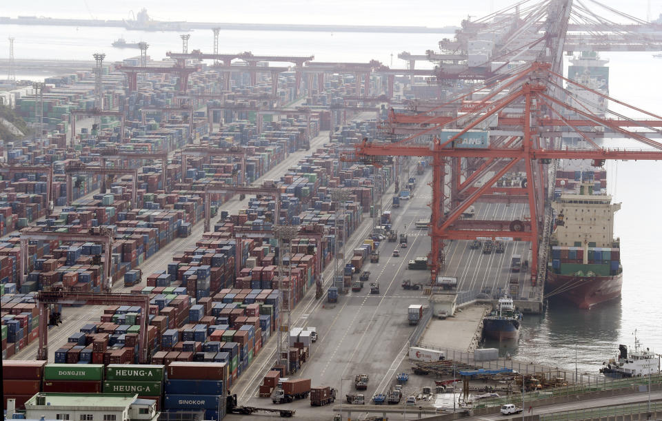 Cargo trucks move into a port in Busan, South Korea, Friday, Dec. 9, 2022. Thousands of South Korean truckers are returning to work after voting Friday to end their 16-day walkout that has disrupted construction and other domestic industries. (Kang Duck-chul/Yonhap via AP)