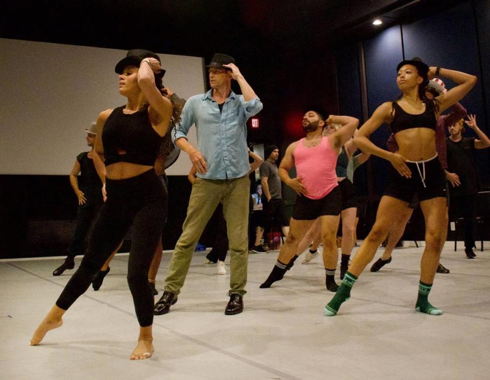 Nathan Darrow, in blue shirt, rehearses with the rest of the cast of “A Chorus Line.” Darrow, known for his TV roles in “House of Cards,” “Gotham” and “Billions,” will play director and choreographer Zach in the musical that will run Aug. 10-27 at Music Theater Heritage.