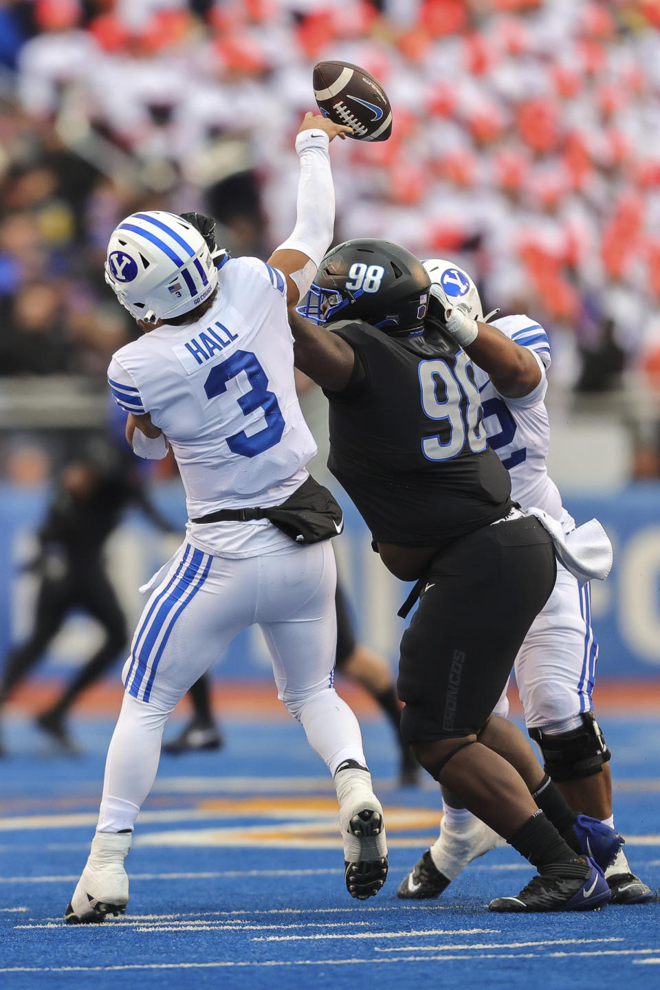 BYU quarterback Jaren Hall (3) is hit as he throws by Boise State nose tackle Herbert Gums (98) in the first half of an NCAA college football game, Saturday, Nov. 5, 2022, in Boise, Idaho. (AP Photo/Steve Conner)