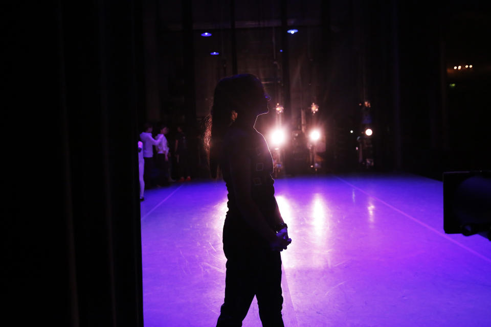 Dancer Lusian Hernandez, walks backstage during a rehearsal of Vladimir Issaev's rendition of The Nutcracker ballet on Friday, Dec. 13, 2019, in Fort Lauderdale, Fla. More than 20 dancers of Venezuelan origin were playing various roles on a recent performance of the holiday favorite “The Nutcracker.” Some of these dancers are here seeking asylum after fleeing their crisis-torn nation, which is plagued by shortages of food and medicine. (AP Photo/Brynn Anderson)