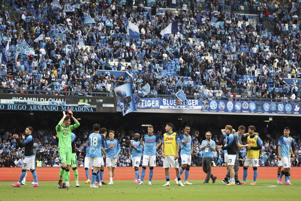 Napoli's players wave to supporters after the Serie A soccer match between Napoli and Salernitana, at the Diego Armando Maradona stadium in Naples, Italy, Sunday, April 30, 2023. The match ended in a 1-1 draw. (Alessandro Garofalo/LaPresse via AP)