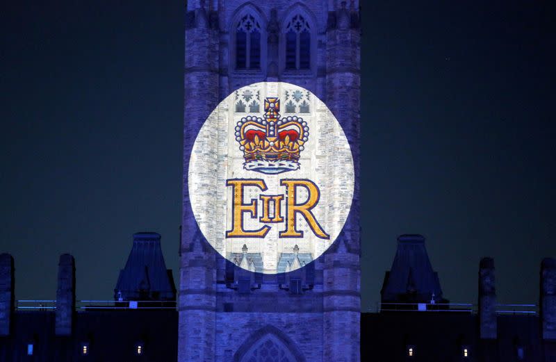FILE PHOTO: Queen Elizabeth's Royal Cypher is projected on the Peace Tower of the Parliament Buildings, after Queen Elizabeth's passing, in Ottawa