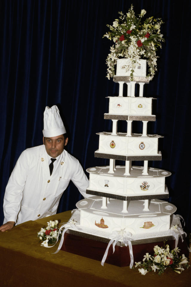 Britain's Prince Charles cuts a birthday cake during a visit to News  Photo - Getty Images