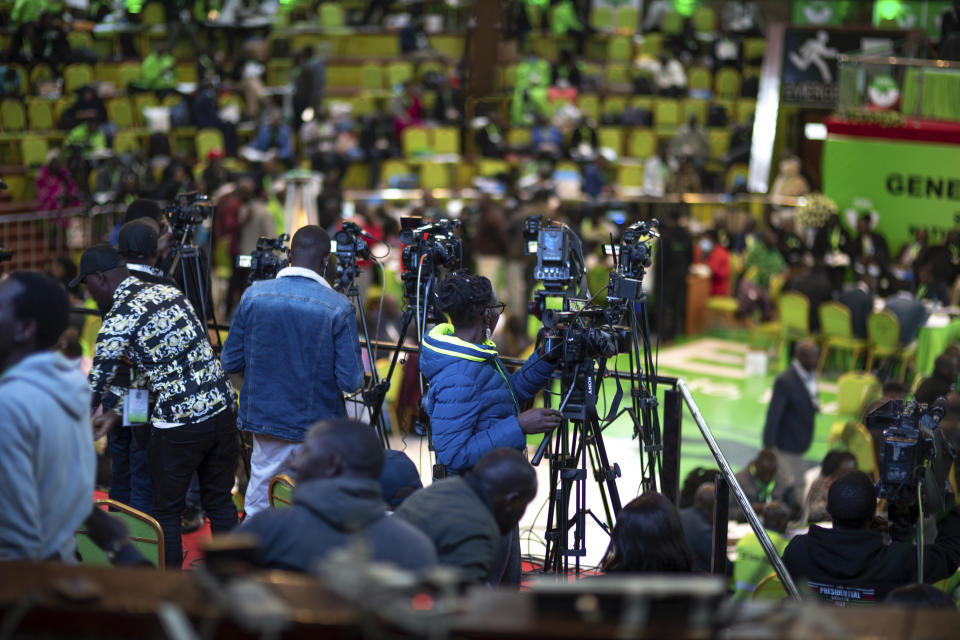 Members of the media follow the vote-tallying at the Electoral Commission headquarters, in Nairobi, Kenya, Friday, Aug. 12, 2022. Vote-tallying in Kenya's close presidential election isn't moving fast enough, the electoral commission chair said Friday, while parallel counting by local media dramatically slowed amid concerns about censorship or meddling. (AP Photo/Mosa'ab Elshamy)