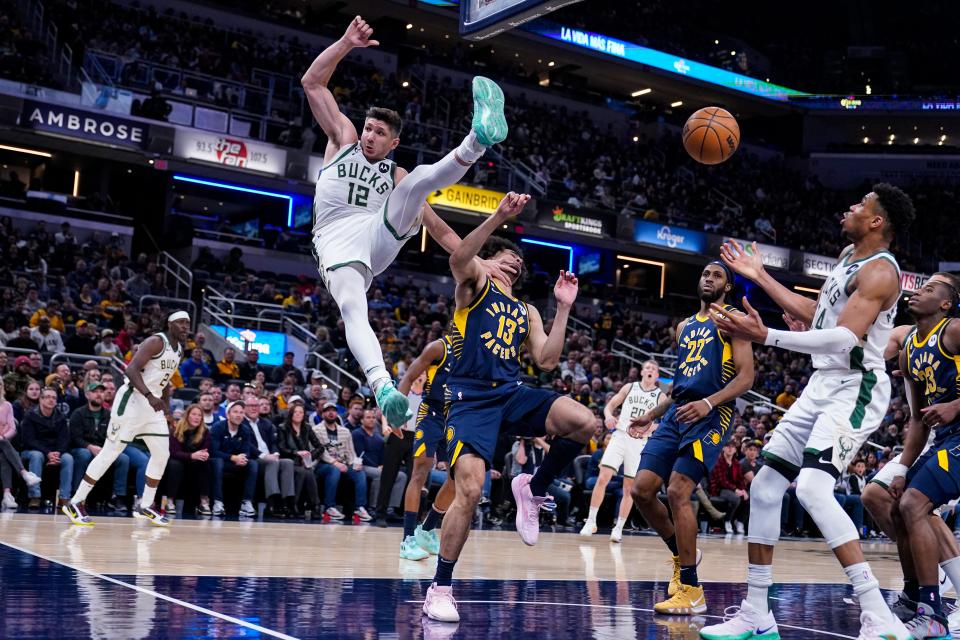 Bucks guard Grayson Allen looses his balance mid-air after being fouled on a dunk by Pacers forward Jordan Nwora (13) during the second half Wednesday.