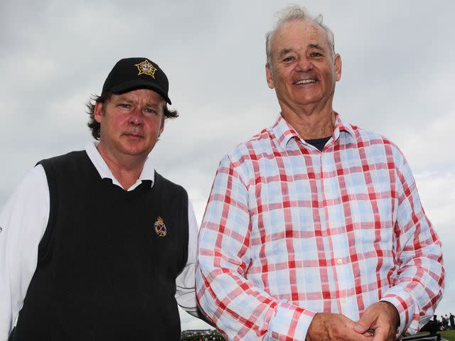 <p>Dean Mouhtaropoulos/Getty</p> Bill Murray and his brother Joel Murray pose on the 18th hole during the Pro Am at the 2012 Irish Open.