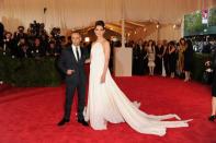 Designer Francisco Costa, left, and Katie Holmes attend The Metropolitan Museum of Art's Costume Institute benefit celebrating "PUNK: Chaos to Couture" on Monday, May 6, 2013 in New York. (Photo by Evan Agostini/Invision/AP)