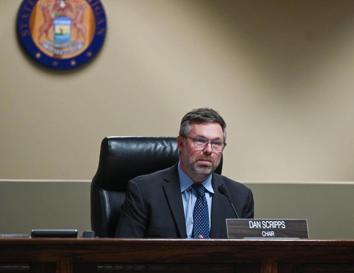 Michigan Public Service Commission Chair Dan Scripps listens to public commentary, Thursday, Nov. 9, 2023, during a MPSC meeting in Lansing.