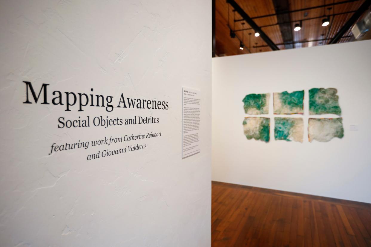 "Mapping Awareness: Social Objects and Detritus" is the current exhibition at the Robert & Margaret Carolla Arts Exhibition Center. The exhibition features Midwest artists Catherine Reinhart and Giovanni Valderas.