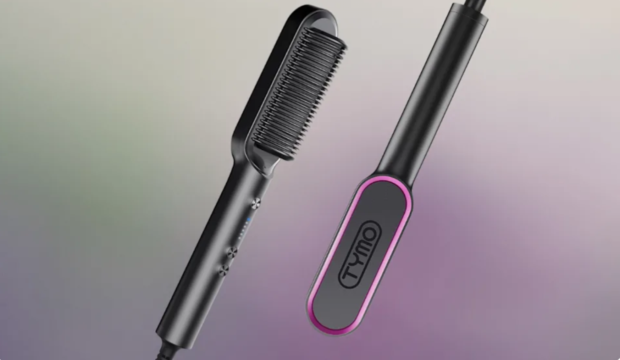 The front and back comb portion of a comb hair straightener, black and pink with the name 