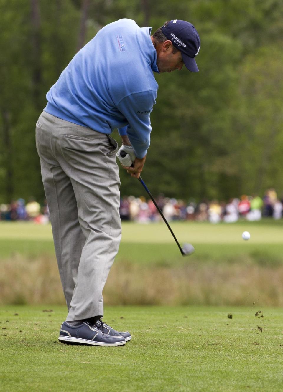 Matt Kuchar hits off the tee on the ninth hole during the third round of the Houston Open golf tournament on Saturday, April 5, 2014, in Humble, Texas. (AP Photo/Patric Schneider)