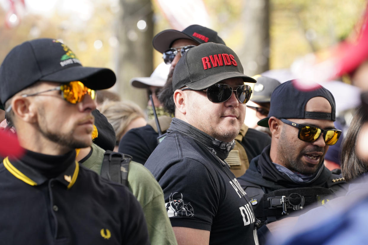 People identifying themselves as members of the Proud Boys join supporters of then-President Donald Trump in Washington, D.C.