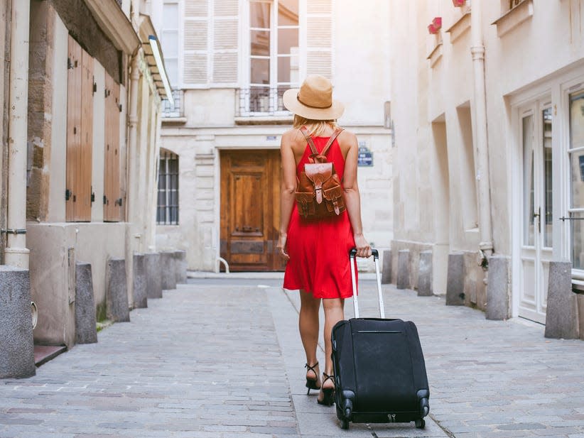 woman traveler luggage europe