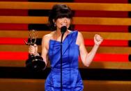 Director Gail Mancuso accepts the award for Outstanding Directing For A Comedy Series for "Modern Family" during the 66th Primetime Emmy Awards in Los Angeles, California August 25, 2014. REUTERS/Mario Anzuoni