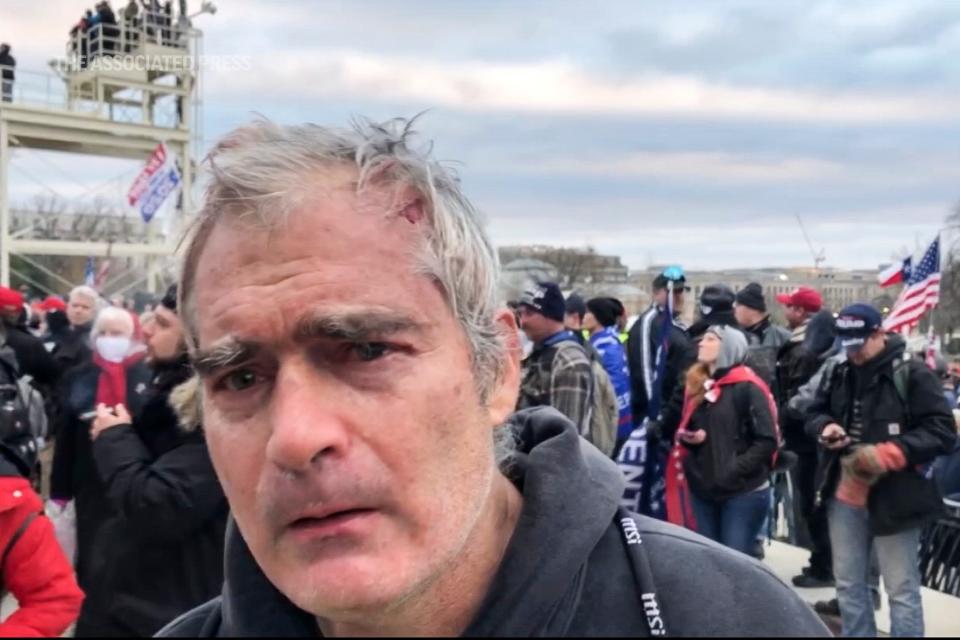 This image from video recorded Jan. 6, 2021, captures Vincent Gillespie on the grounds of the U.S. Capitol in Washington, where prosecutors say he was among a rioting mob trying to gain control of the building from the federal government. Gillespie, the son of a renowned American painter, was convicted Friday, Dec. 23, 2022, of four counts of participating in the 2021 assault on the U.S. Capitol.