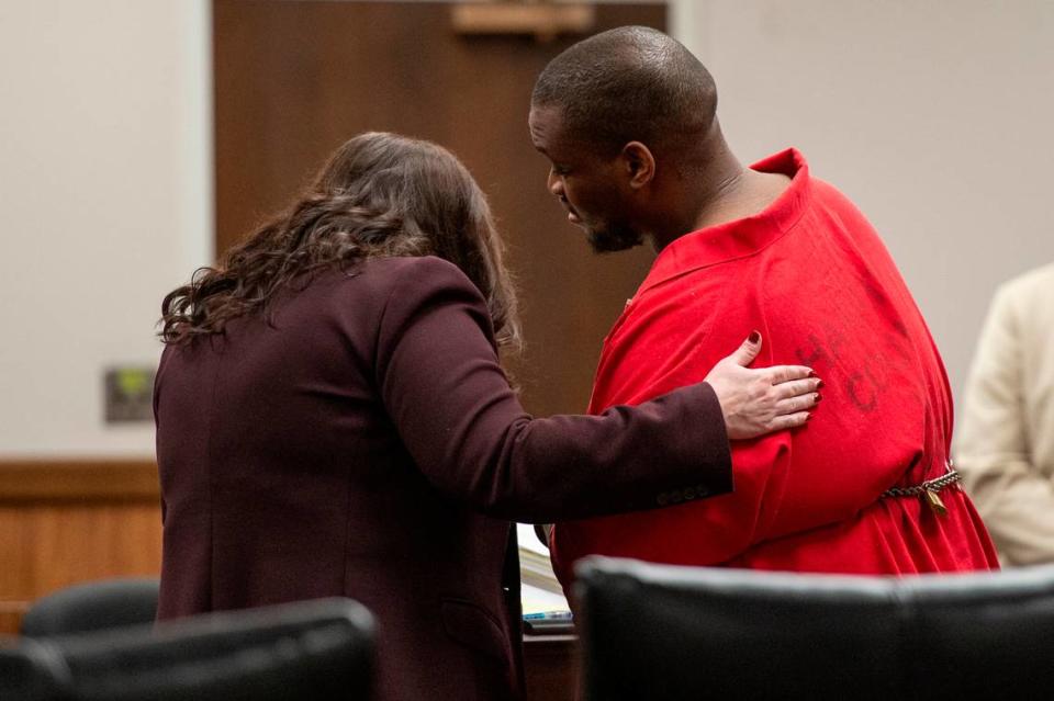 Andrew Malik Jones, who is accused of raping a woman at an outlet mall, talks to his attorney Angela Broun during his plea hearing at Harrison County Courthouse in Gulfport on Wednesday, Jan. 17, 2024. Jones pleaded guilty to three charges including sexual battery.