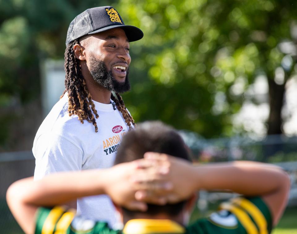 Green Bay Packers running back Aaron Jones surprises children for his Yards for Shoes campaign at the Boys & Girls Club of Greater Green Bay in 2021.