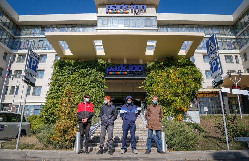 FILE PHOTO: Protesters hold a rally in front of the Park Inn hotel housing OSCE monitor mission in the rebel-controlled city of Donetsk