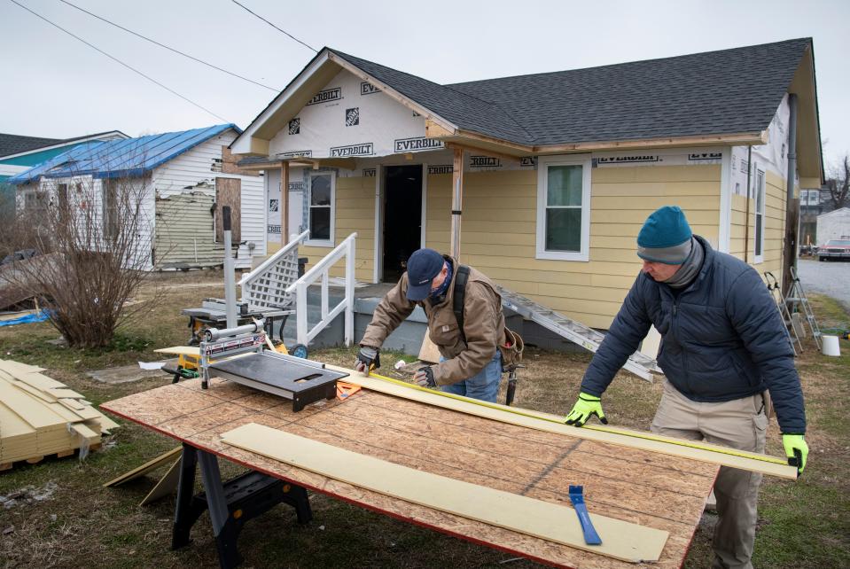 Steve LaForge and Alan Sowell of Hope Force International work to repair the tornado damaged home of Daniel McDaniel on Friday, Feb. 12, 2021 in Nashville, Tenn.