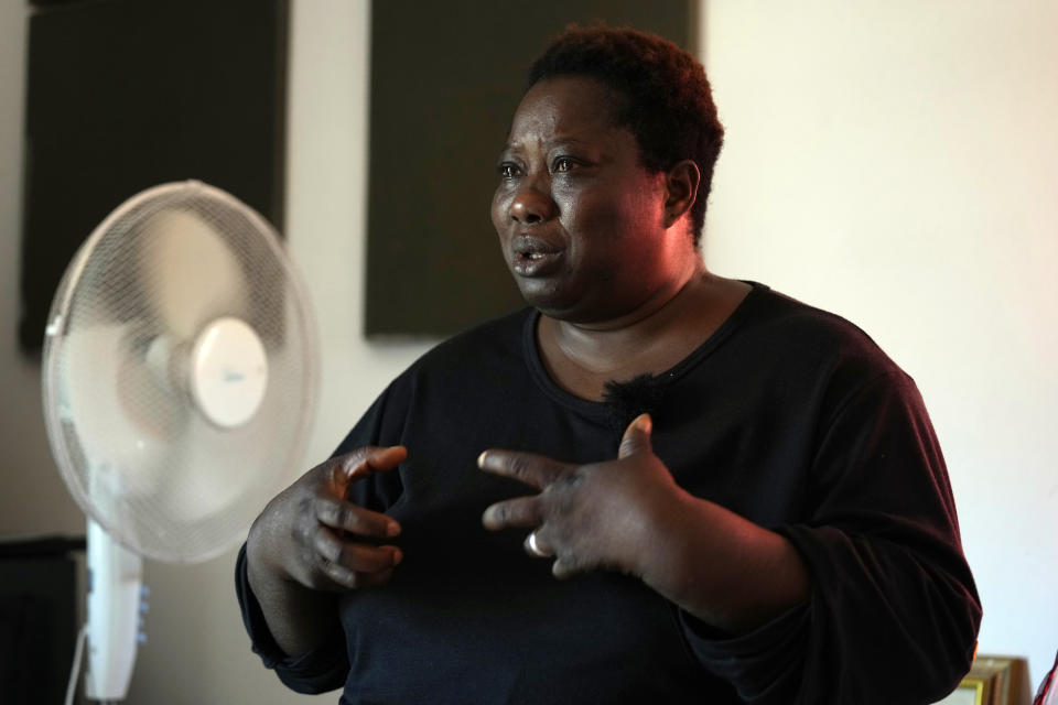 Charity Oriakhi, widow of a street vendor Alika Ogochukwu, talks with journalist during an interview with Associated Press at her home in San Severino Marche, Italy, Friday, Aug. 5, 2022. The brutal killing of a Nigerian immigrant in broad daylight has sparked a debate in this well-to-do Adriatic beach community over whether the attack by an Italian man with a court-documented history of mental illness was racially motivated. It will go to the streets on Saturday, Aug. 6 when a Black Italian activists from all over Italy march through the town demanding justice for Alika Ogorchukwu. (AP Photo/Antonio Calanni)