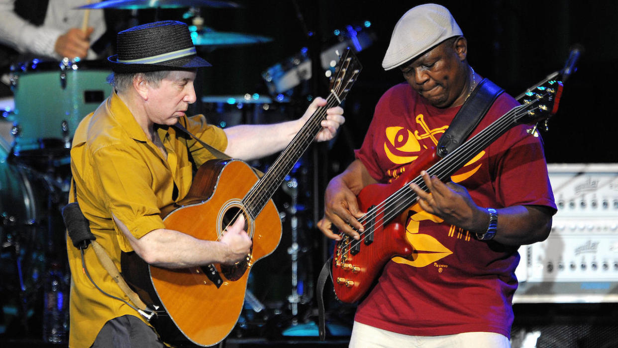  Paul Simon (L) performs with bass guitarist Bakithi Kumalo on the Auditorum Stravinski stage during the 42nd Montreux Jazz Festival on July 9, 2008 in Montreux. 
