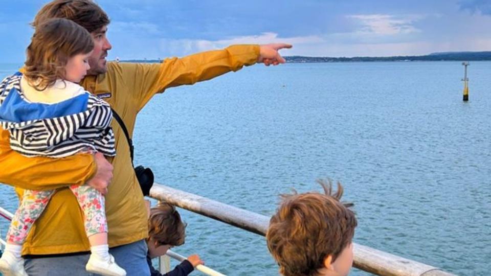 charlie thomson on boat with three children 