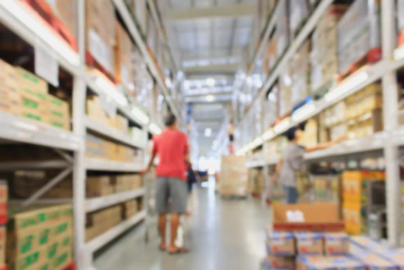 A man shops at a warehouse club.