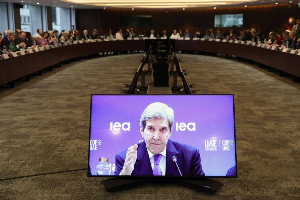 John Kerry is seen on a screen as he speaks during a high-level round table on COP energy and climate commitments organized by the International Energy Agency at its headquarters in Paris on Feb. 20, 2024.<span class="copyright">Alain Jocard—AFP/Getty Images</span>