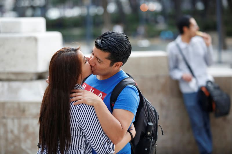 FILE PHOTO: A couple kiss outside the Palacio de Bellas Artes in Mexico City