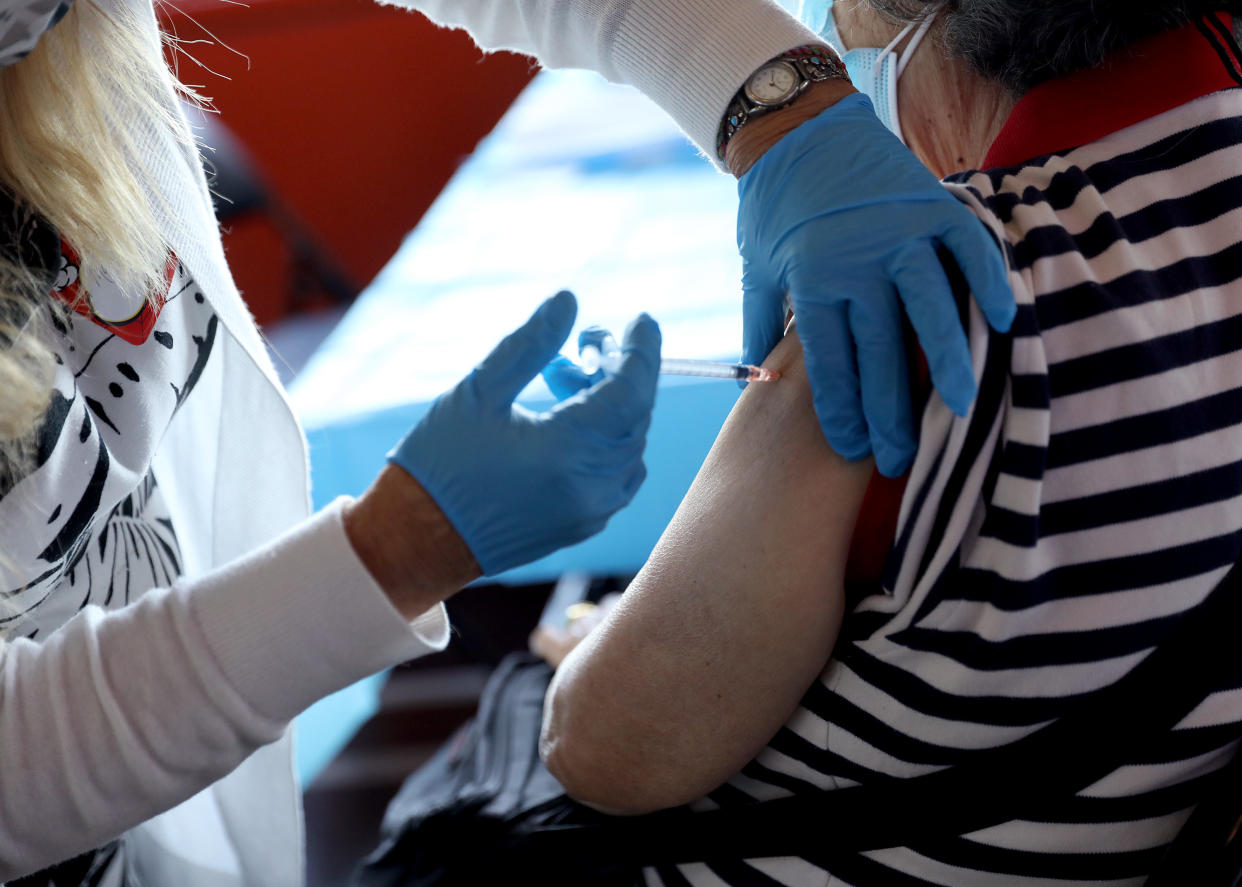 A healthcare worker administers the vaccine as the Empire State Building Offers COVID-19 Vaccines at its Observatory on June 18, 2021 in New York City. (Monica Schipper/Getty Images for Empire State Realty Trust, Inc.)