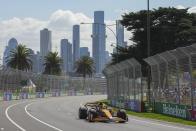 McLaren driver Lando Norris of Britain steers his car during the first practice session of the Australian Formula One Grand Prix at Albert Park, in Melbourne, Australia, Friday, March 22, 2024. (AP Photo/Scott Barbour)