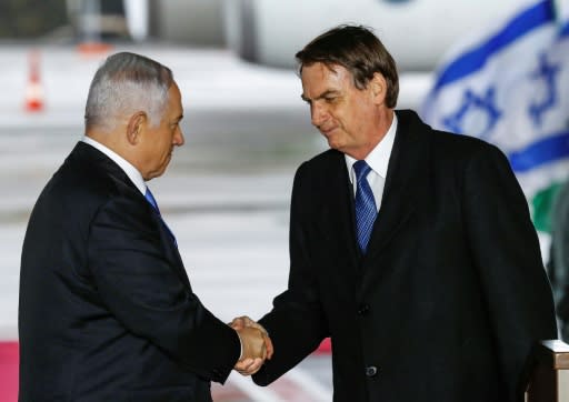 Brazilian President Jair Bolsonaro (R) was greeted on arrival in Israel by Prime Minister Benjamin Netanyahu