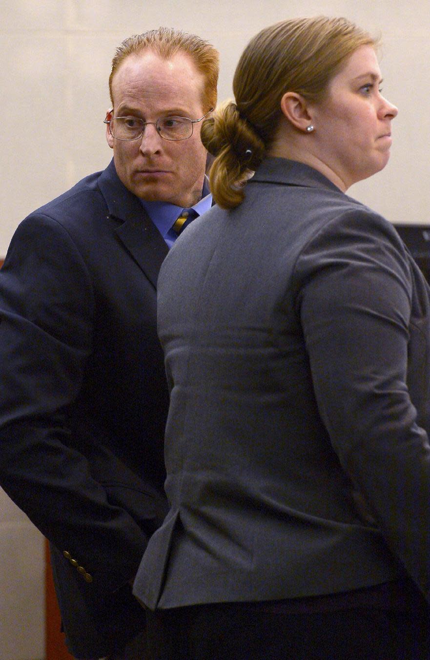 Eric Millerberg watches as attendants at his trial file out of the courtroom, Wednesday, Feb. 12, 2014, in Ogden, Utah. Millerberg has been charged with injecting his 16-year-old baby sitter, Alexis Rasmussen, with a fatal dose of heroin and methamphetamine, then taking his wife and infant daughter along to dump Rasmussen's body near a river. (AP Photo/The Salt Lake Tribune, Leah Hogsten, Pool)