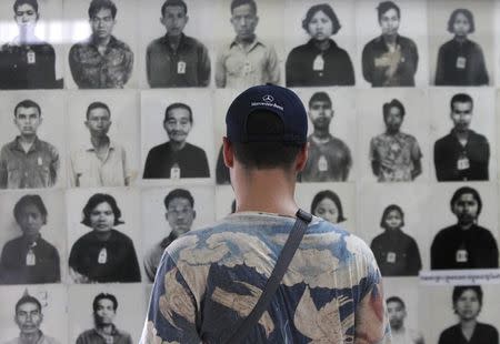 A tourist visits the Tuol Sleng Genocide Museum, also known as the notorious security prison S-21, in Phnom Penh March 3, 2015. A U.N.-backed war crimes tribunal in Cambodia on Tuesday charged two former cadres of the Khmer Rouge regime with crimes against humanity over their alleged roles in the deaths of an estimated 1.8 million people in the 1970s. REUTERS/Samrang Pring