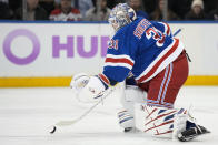 New York Rangers goaltender Igor Shesterkin (31) makes a save far from goal in the second period of an NHL hockey game against the New Jersey Devils, Monday, Nov. 28, 2022, in New York. (AP Photo/John Minchillo)