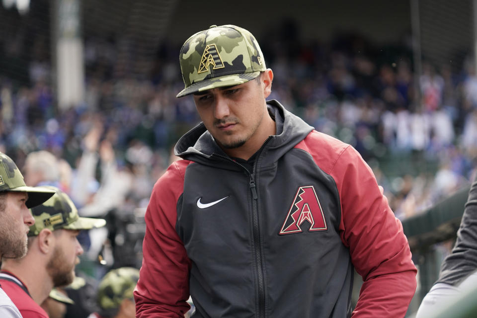 Arizona Diamondbacks' Josh Rojas reacts as he walks in the dugout during the eighth inning of a baseball game against the Chicago Cubs in Chicago, Sunday, May 22, 2022. The Cubs won 5-4. (AP Photo/Nam Y. Huh)