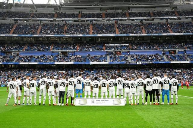 <a class="link " href="https://sports.yahoo.com/soccer/teams/real-madrid/" data-i13n="sec:content-canvas;subsec:anchor_text;elm:context_link" data-ylk="slk:Real Madrid;sec:content-canvas;subsec:anchor_text;elm:context_link;itc:0">Real Madrid</a> players wore <a class="link " href="https://sports.yahoo.com/soccer/players/3862919" data-i13n="sec:content-canvas;subsec:anchor_text;elm:context_link" data-ylk="slk:Vinicius;sec:content-canvas;subsec:anchor_text;elm:context_link;itc:0">Vinicius</a> number 20 shirts ahead of their win over <a class="link " href="https://sports.yahoo.com/soccer/teams/rayo-vallecano/" data-i13n="sec:content-canvas;subsec:anchor_text;elm:context_link" data-ylk="slk:Rayo Vallecano;sec:content-canvas;subsec:anchor_text;elm:context_link;itc:0">Rayo Vallecano</a>