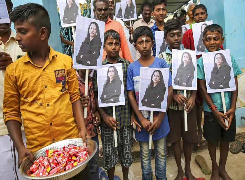 Villagers hold portraits of US. Vice President-elect Kamala Harris after participating in special prayers ahead of her oath taking ceremony, at Thulasendrapuram- hometown of Harris’ maternal grandfather, in Tiruvarur district, on Wednesday, 20 January 2021.