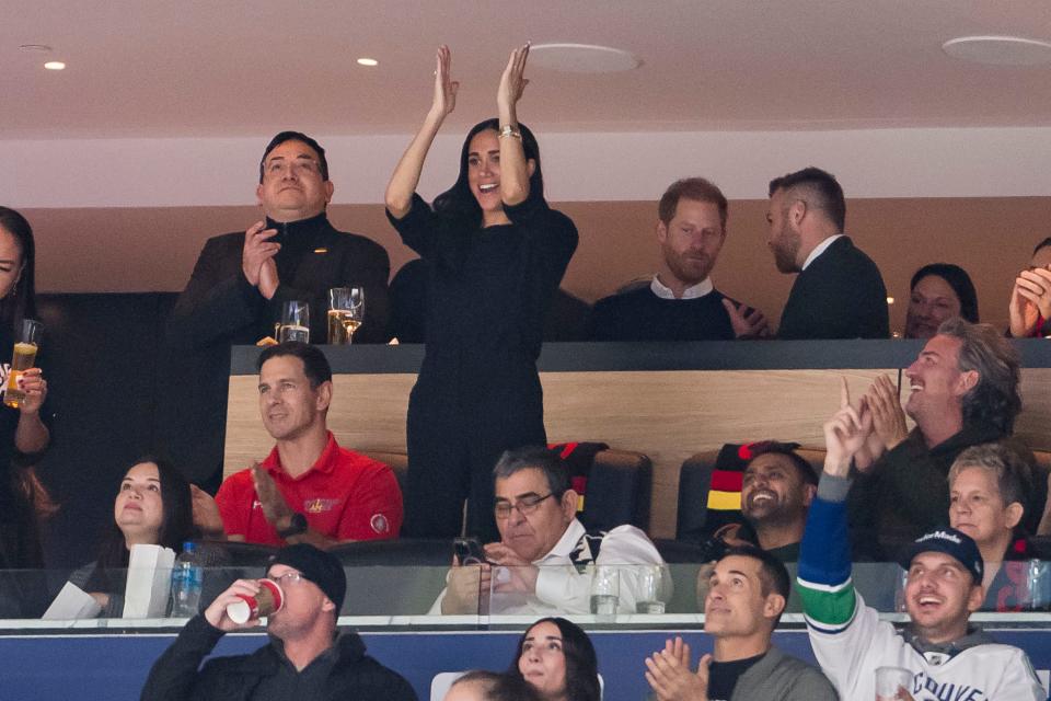 Harry and Meghan watch as the Vancouver Canucks and San Jose Sharks face off.