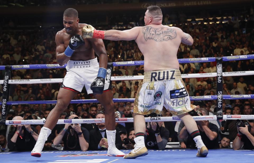 Andy Ruiz, right, punches Anthony Joshua during the third round of a heavyweight title boxing match Saturday, June 1, 2019, in New York. (AP Photo/Frank Franklin II)