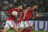 Al Ahly's Ali Maaloul, left, celebrates after scoring his side's opening goal from a penalty kick during the FIFA Club World Cup semi final match between Al Ahly and Real Madrid at Prince Moulay Abdellah stadium in Rabat, Morocco, Wednesday, Feb. 8, 2023. (AP Photo/Mosa'ab Elshamy)