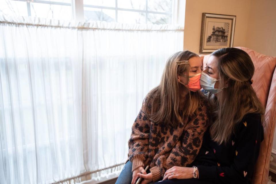 Maura Wozniak poses for a portrait with her daughter, Elinor, in Huntersville, NC, on Thursday, February 18, 2021.