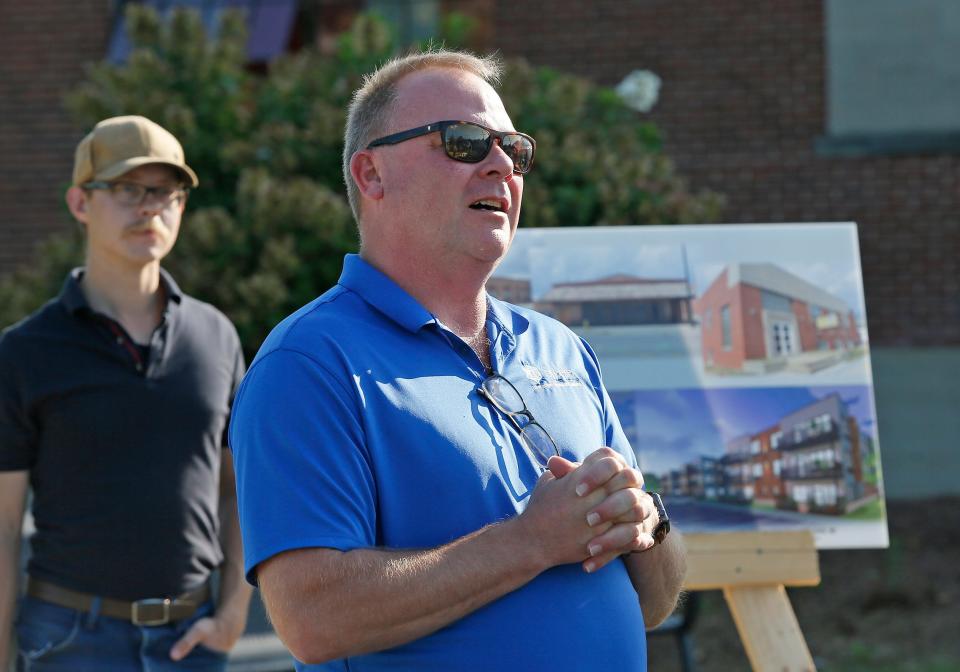 Dusty Steele, chairperson at the Adrian Downtown Development Authority and the Kiwanis Regional Trail Authority, talks about the Kiwanis Trail updates at a River Raisin cleanup event Aug. 27, 2022, in downtown Adrian, held in support with the River Raisin Watershed Council.