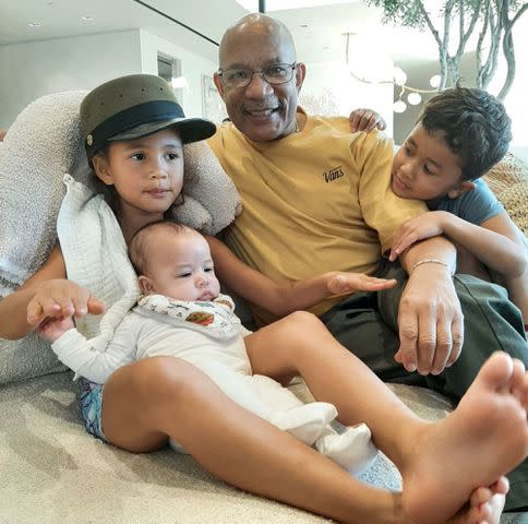 <p>John Legend Instagram</p> Ronald Stephens with his grandchildren, Luna, Miles, and Esti