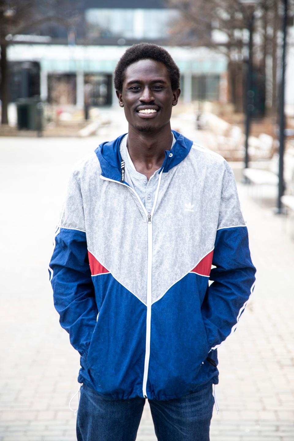 Mohamed Traore poses for a photo, Friday, March 5, 2021, in downtown Iowa City, Iowa.