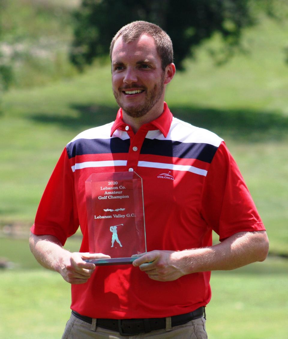 Justin Arnt proudly shows off his 2020 Lebanon County Amateur trophy.