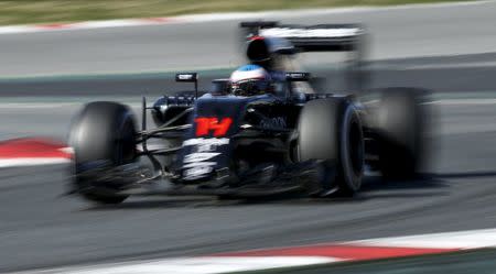 McLaren Formula One driver Fernando Alonso takes a curve during a testing session at Barcelona-Catalunya racetrack in Montmelo, near Barcelona, Spain, March 1, 2016. REUTERS/Albert Gea