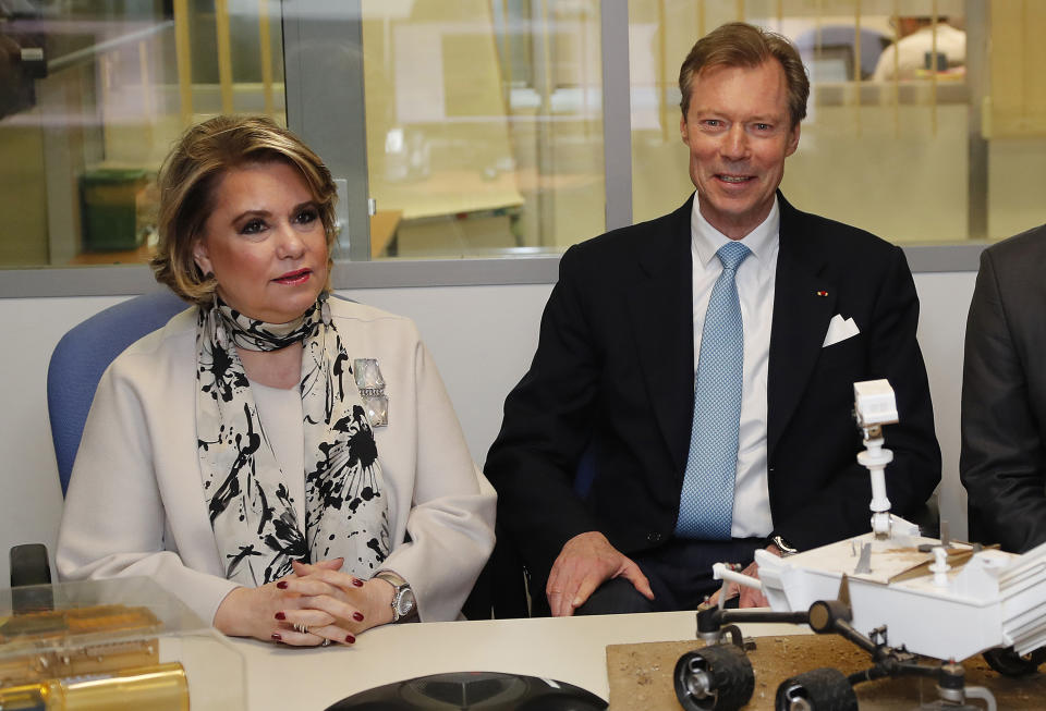 Grand Duke Henri of Luxembourg and Grand Duchess Maria-Teresa of Luxembourg attend a visit at the National Centre for Space Studies (CNES) in Toulouse, southwestern France, Wednesday March 21 2018. (Guillaume Horcajuelo, Pool via AP)