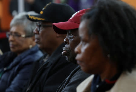 Veterans listen closely to Democratic gubernatorial candidate for Georgia, Stacey Abrams, ahead of the midterm elections in Riverdale, Georgia, U.S., October 27, 2018. REUTERS/Lawrence Bryant